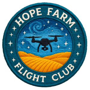 Embroidered circular patch featuring a drone flying over golden farm fields beneath a swirling starry night sky, with the words “Hope Farm Flight Club” around the border.