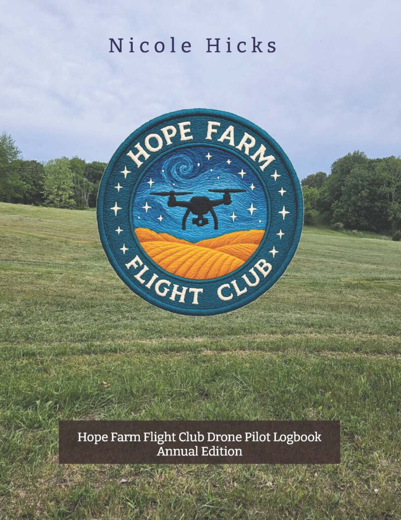 Front cover showing “Nicole Hicks” above an embroidered “Hope Farm Flight Club” patch with a drone over hills and stars, on a grassy field background; title reads “Hope Farm Flight Club Drone Pilot Logbook Annual Edition.”